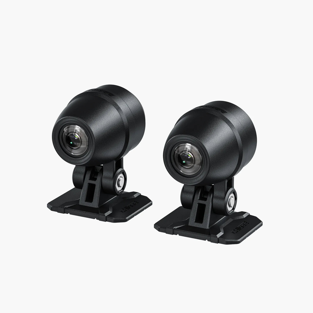 Two black camera units on a white background